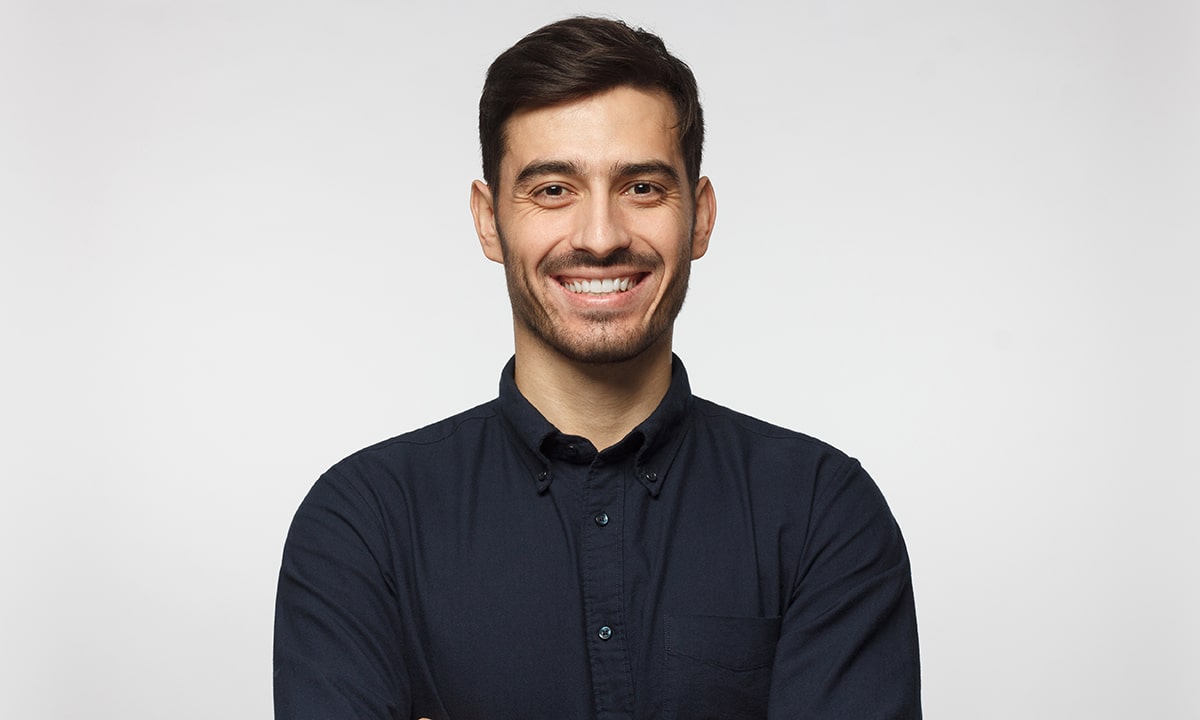 Man Smiling after receiving Dental Veneers