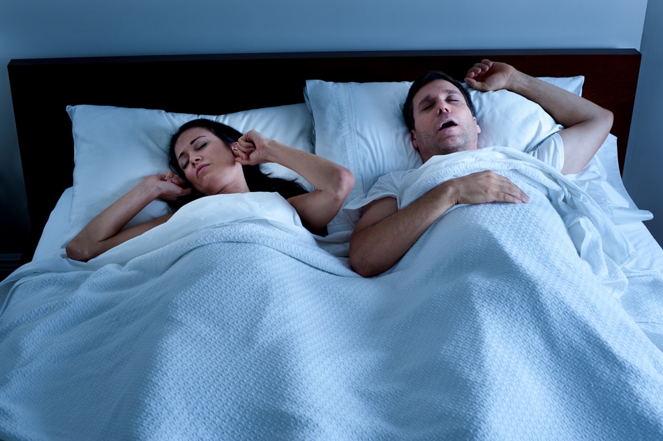 Couple experiencing sleep apnea issues