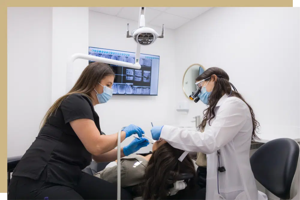 Expert Torrance Prosthodontist Dr. Alejandra Rodriguez works with a patient